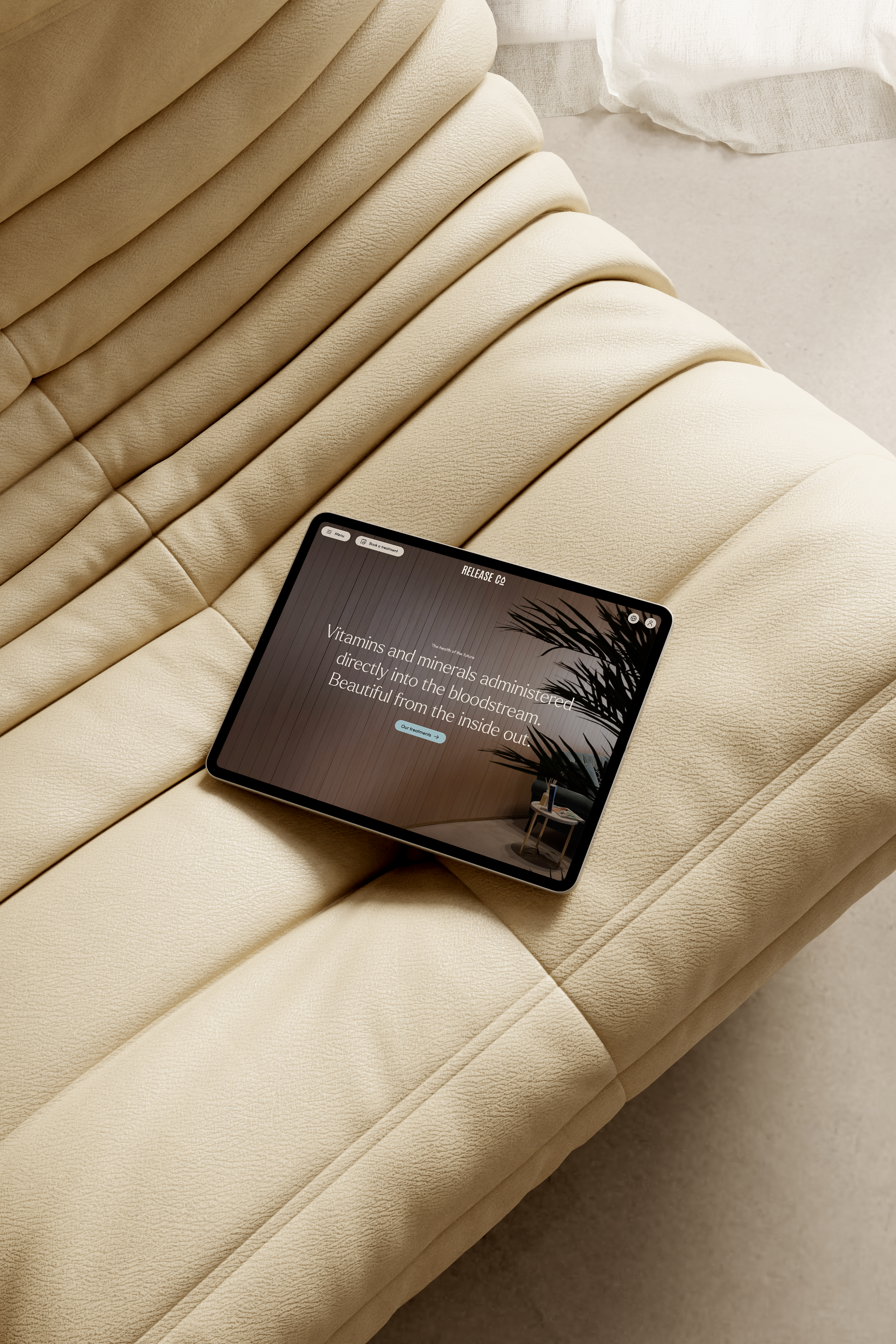 Release Co Tablet on a sofa